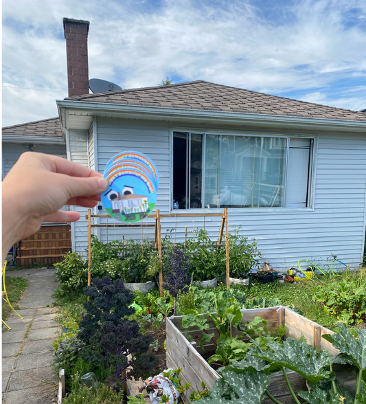 the "don't demovict me bro" sticker held up with the in real life house in the background