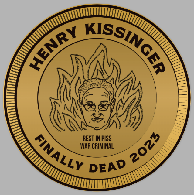 Circle metallic gold sticker made to look like a commemorative coin of henry kissinger surrunded by the flames of hell - his name is at the top, then it says "rest in piss war criminal" and "finally dead 2023"