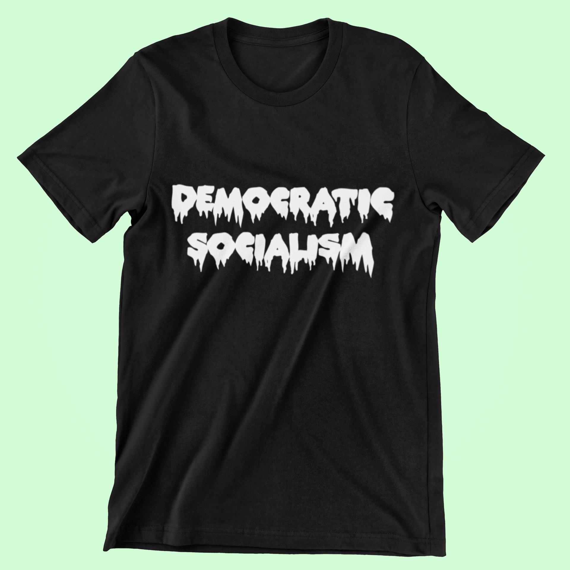 Black cotton unisex t-shirt with white spooky halloween text reading "Democratic Socialism" on a mint green background