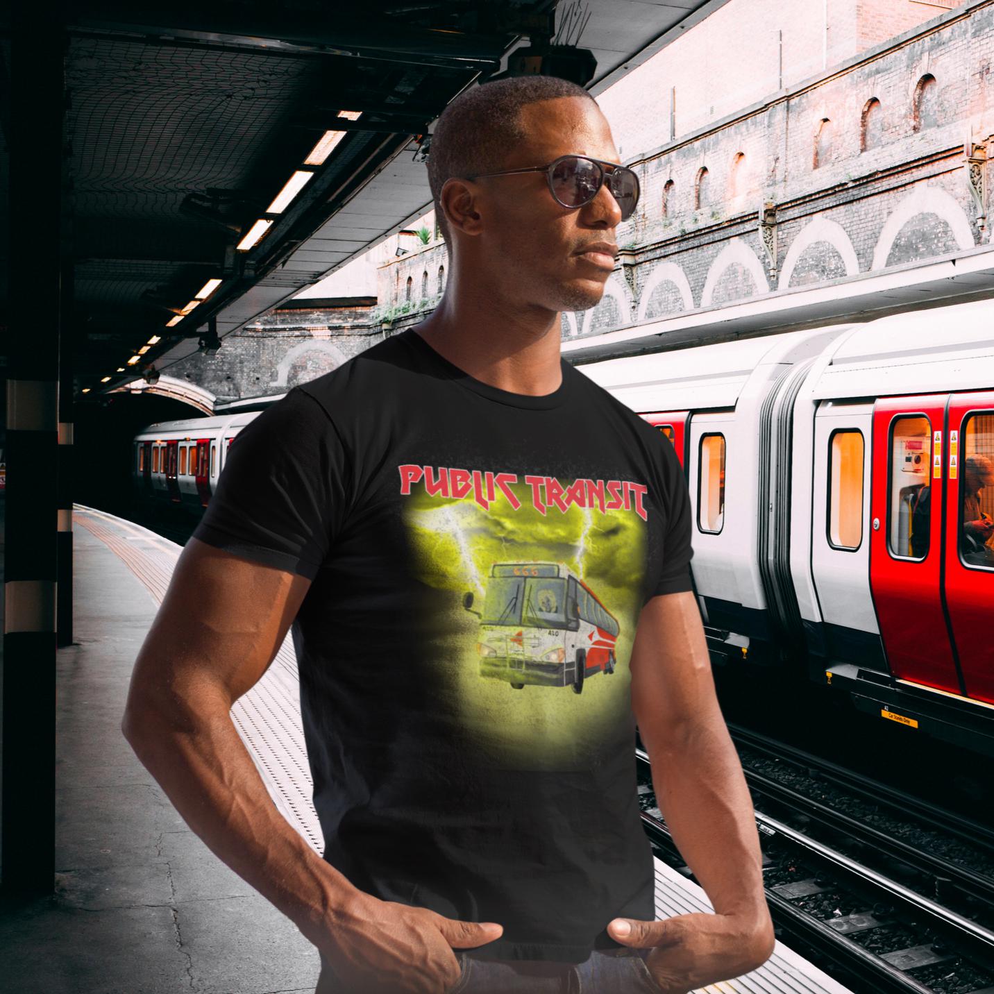 guy on train platform wearing black t-shirt with the words public transit in red metal band font and a red city bus with a skeleton driver and the route number 666 all surrounded by glowing yellow clouds and lightning